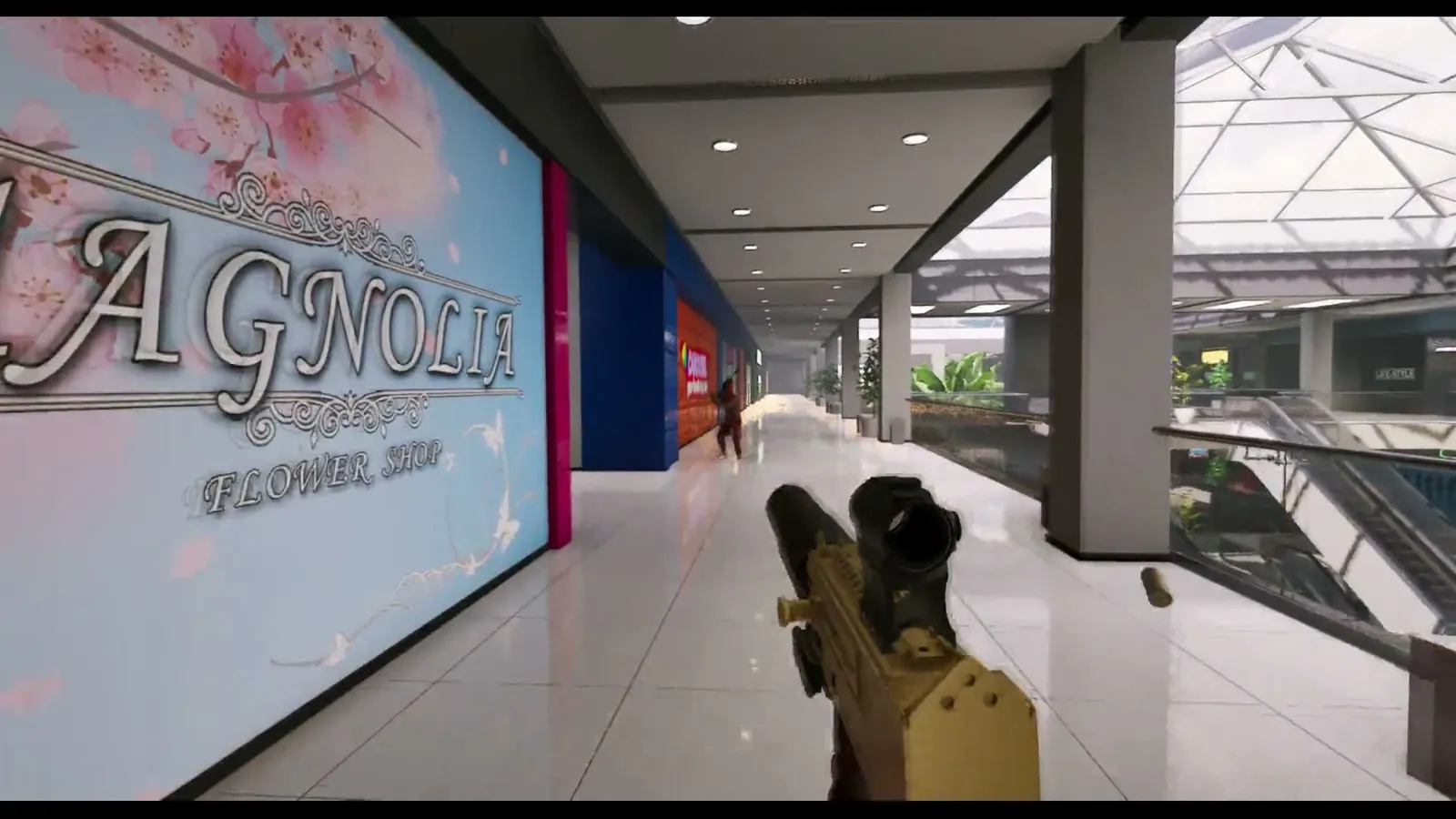 Gold plated rifle raised inside a bright shopping mall walkway